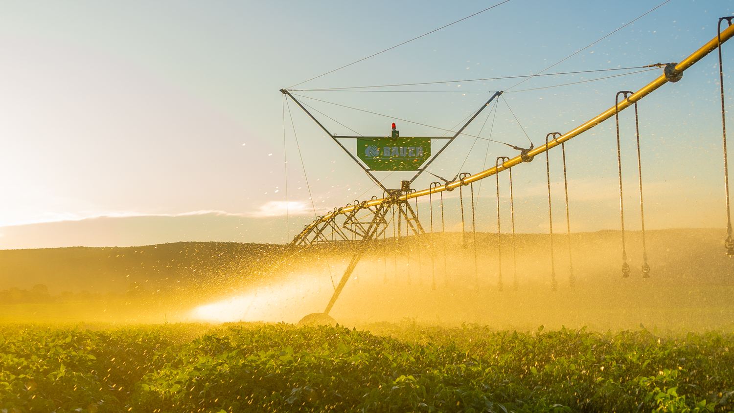 Pivot irrigation at sunset